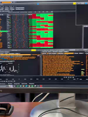 The cover image shows a close-up of a computer monitor displaying the Bloomberg Terminal interface. The screen is divided into multiple windows showing real-time financial data in various formats, including tables of numbers and charts. The main interface has a black interface with colorful data representations and information.