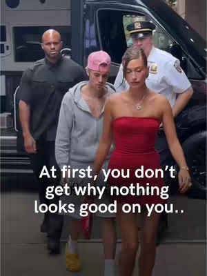 The image shows a group of people walking in an urban setting. In the foreground, a woman in a red dress and a man with a pink baseball cap are walking. The woman is the focal point. The background features a black vehicle and other people including a police officer. A text overlay provides context.