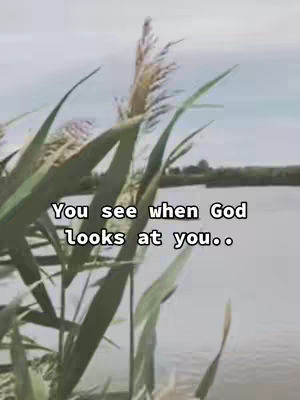 The cover image shows a natural scene with tall grass or reeds in the foreground. A body of water and a blue and grey sky fill the background. Text overlayed on the image states, You see when God looks at you..'