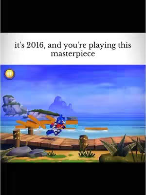 The cover image is a still from a video game set on a wooden pier with water and a clear sky in the background. A cartoon character, resembling Optimus Prime, is mid-air in a jumping pose. Text overlays at the top of the image state the year as 2016 and describe the game as a masterpiece.