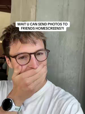 A man with glasses covers his mouth with his hand, looking surprised. Text on the image reads, 'WAIT U CAN SEND PHOTOS TO FRIENDS HOMESCREENS?!'