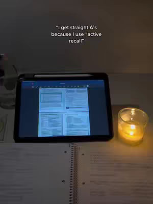 A dimly lit scene shows a desk with an open notebook, an iPad displaying notes, a lit candle, and a pen. The iPad screen shows documents displayed in a tiled layout. The overall tone suggests a study environment, possibly at night. Text overlays provide context.