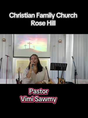 The cover image features a woman speaking into a microphone in what appears to be a church setting. The upper portion of the image is dark, with white text overlayed with information about the church services and contact information. Background behind includes a screen with a cross image on it and the general church stage setup with microphones and stands.