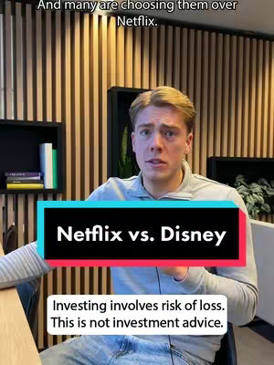 A man with light hair and a grey shirt in a professional setting is speaking to the camera. Overlaid on the image is a black banner with white text, and a smaller white banner with black text underneath. The background consists of vertical wooden panels.