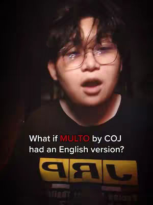 A young man with glasses holding his mouth open is filmed in front of a dark background. The text overlay reads "What if MULTO by COJ had an English version?"