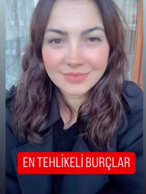 A woman with long, wavy brown hair is centered in the frame, looking directly at the camera with a slight smile. She is wearing a black top. Overlayed on the image is a red rectangular banner with the white text "EN TEHLIKELI BURÇLAR". The background appears to be a mix of green foliage and an out-of-focus interior.