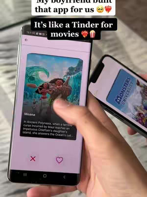 A person holds two smartphones. One phone shows a movie poster on a dating app, the other phone shows the monster university app on phone.
