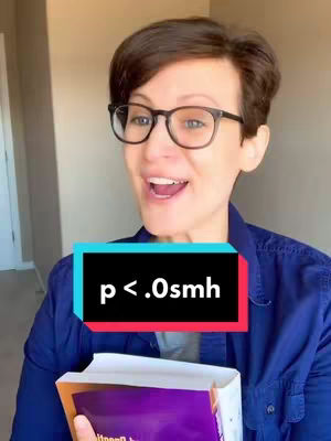 A woman with short dark hair and glasses is looking at the camera with an open mouth, as if speaking. The background is a light-colored wall and an open doorway. She wears a blue button-down shirt over a white undershirt. A book with a purple cover is held in her hands. A rectangular graphic with the text 'p < .0smh' is in front of her.