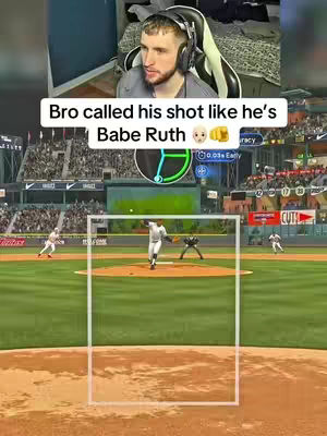 The cover image shows a split view: the top half features a man with headphones in front of an armchair, while the bottom half depicts a baseball video game with players on the field. The top half shows the creator reacting.