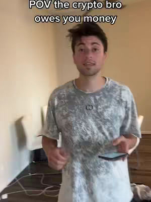 A man in his 20s or 30s wearing a grey patterned t-shirt stands indoors against a plain wall. Text overlay indicates a "POV" perspective.