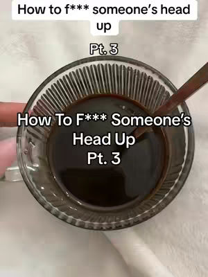 The cover image features a close-up shot of a glass cup filled with a dark, opaque liquid, possibly coffee, with a spoon resting inside. The cup sits on a white surface. The video overlay includes text over the liquid and the cup, and the background seems to be a plain or textured surface. The composition is simple.