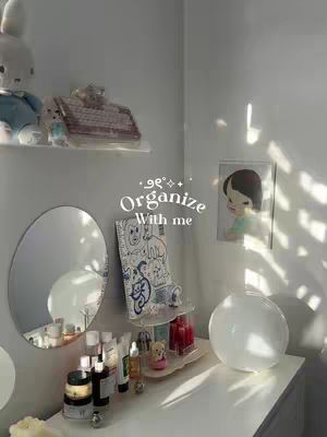 The cover image shows a well-lit, bright, and clean room corner with a white dresser. A mirror, decor, and other items create a cozy setting bathed in sunlight.