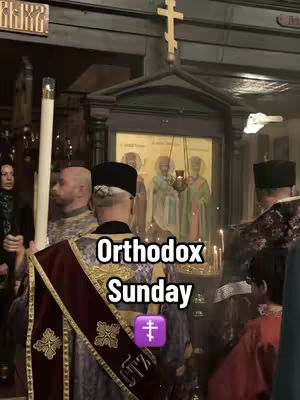 An interior shot captures a dimly lit Orthodox church service. A man in ornate vestments with a red and gold sash is seen from the back, facing towards a central altar with an icon. Other figures in traditional clothing stand around. The image is framed with a wooden cross and candles, creating a solemn atmosphere. Overlaid text says 'Orthodox Sunday' with a cross emoji.