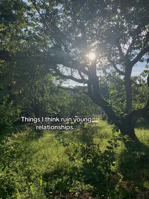 The cover image shows a sunlit forest scene with lush greenery and a bright sky visible through the tree canopy. The foreground is filled with grass and low-lying plants, while the text overlay reads "Things I think ruin young relationships..."