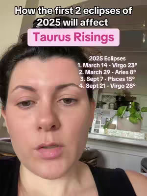 A selfie-style video with a woman in the foreground and a kitchen background. The woman is looking directly at the camera and speaking. Overlay text indicates the video is about eclipses and astrology.