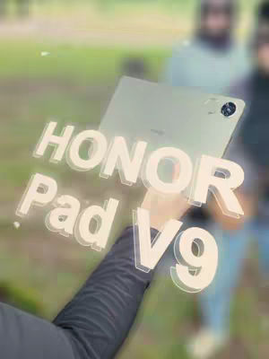 A person is holding a tablet up in front of them with text overlayed on the image.