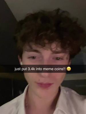 A selfie-style image shows a young man with dark, curly hair in a dimly lit setting. He is wearing a white shirt and has a subtle, slightly amused expression. The hook text overlays a black bar at the bottom, with white text.
