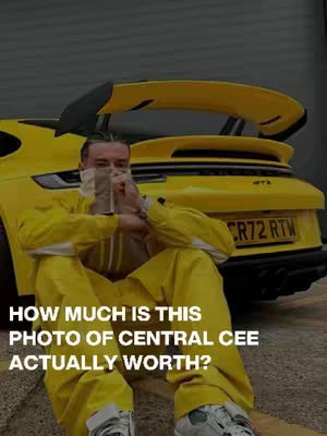 The image shows a man in a yellow jumpsuit sitting in front of a yellow sports car. The man's face is partially covered. Text overlayed on the image asks how much the photo is worth.