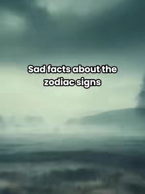 The image shows a blurred, moody landscape, likely a body of water and distant land, under a cloudy sky. Centered, overlaid text reads "Sad facts about the zodiac signs". The overall color palette is muted, with shades of gray and blue, creating a somber and contemplative atmosphere.