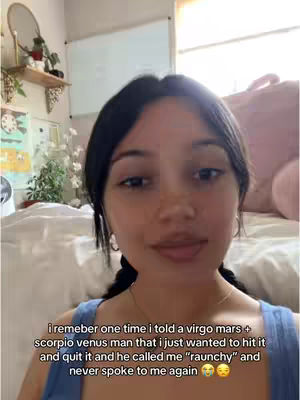 A young woman with dark hair pulled back and wearing a blue top is the central focus. The image displays a domestic setting with a bed and a whiteboard visible in the background. Text overlayed on top shares a personal story.