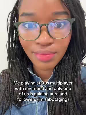A close-up shot of a person wearing glasses with dark frames, set against a light background. The person has dark, braided hair and is looking slightly to the side with a subtle smile. The image is well-lit, highlighting the facial features and the text overlayed at the bottom.