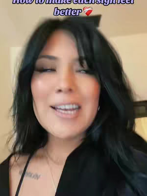 The cover image shows a close-up of a woman with long black hair and makeup, looking slightly off-camera and smiling. Text overlays the image.