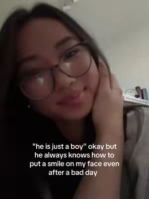 The cover image is a selfie of a young woman with long, dark hair and glasses. She is looking towards the camera with a slight smile, resting her hand on her cheek. Text overlayed on the image conveys a romantic sentiment.