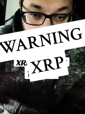 A man in glasses is seen in the cover image, with a white overlay reading 'WARNING' and smaller 'XRP' text, partly obscuring his face and upper body.