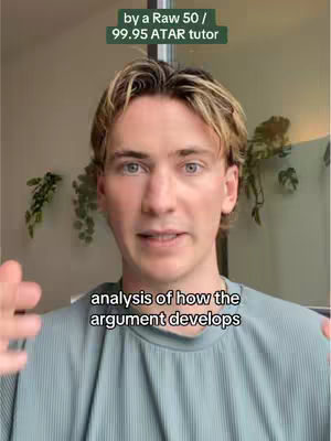 A young man with light-colored hair and a light blue shirt faces the camera with a neutral expression. Text overlays are present at the top and bottom of the frame.