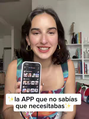 A woman with dark hair framed by a shelf and a bright background is holding a smartphone, the screen of which is visible. She is smiling at the viewer and is wearing gold hoop earrings. A text overlay on the bottom of the image highlights the video's topic.