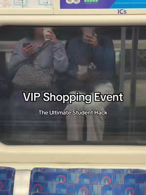 The image shows a view through a train window featuring two people inside. The window has a white border at the top and possibly the bottom, and the background outside the train is blurred. In the foreground are two individuals: one person is holding a phone and possibly a drink, and another person is also holding a phone. The image has superimposed text in the center.