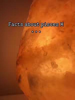 The cover image has an amber textured background with overlaid text. The background covers most of the image, with its color and texture drawing the eye. The text is white and centered. The top text says "Facts about pisces" and the middle has three white dots.