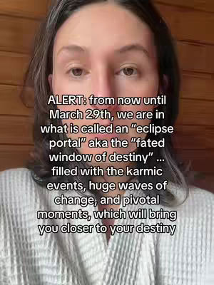 The cover image shows a woman from the chest up, centered in the frame against a blurred wooden panel background. She has brown hair and is wearing a white robe. The overlay text, in a sans-serif font, provides context about an 'eclipse portal' and the themes related to it.