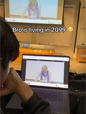 The cover image shows a person sitting in front of a laptop; the screen is playing a lecture and an overlayed text reads, 'Bro is living in 2099'.