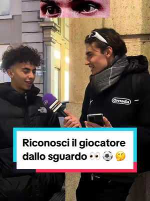 The cover image shows two young men standing, facing each other, in an outdoor setting. The individual on the left is seen holding a microphone with a purple windscreen, as if interviewing the other person on the right. A text overlay at the bottom, in a vibrant colored rectangle, challenges viewers to identify a football player based on their gaze. Further up, two eyes are shown, and above them, the zoomed-in section of the eyes.