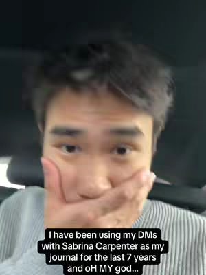 A close-up shot of a man covering his mouth with his hand. He appears to be in a car, with a blurred background. Overlayed text at the bottom describes his use of DMs.