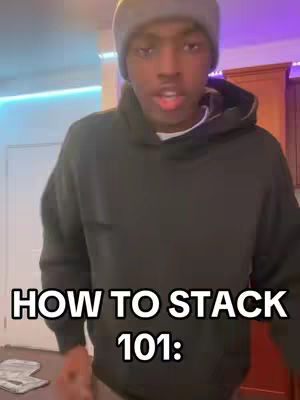 A young Black man wearing a gray beanie and a dark green hoodie stands in front of a brightly lit background. White text overlays the bottom of the image.