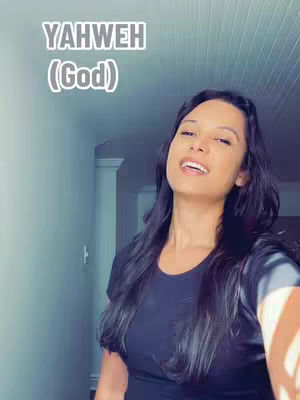 A woman with long black hair is looking upward, slightly off-center, in front of a blurred background. The hook text 'YAHWEH (God)' appears on the top left.
