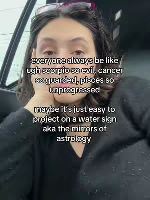 A person is holding their face in their hand while looking towards the camera. Text about water signs is overlayed.