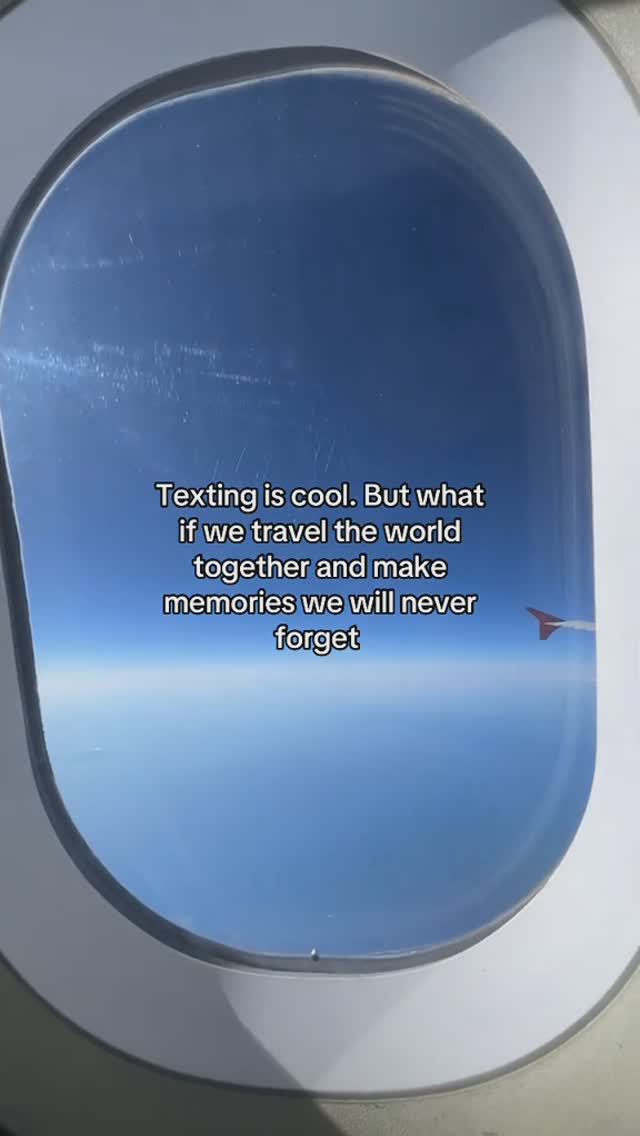 An eye-level shot through an airplane window, capturing a brilliant blue sky. Inside the window's frame, a gentle gradient transitions from a darker blue at the top to a lighter hue towards the horizon. The text overlay is positioned centrally, with clean type.