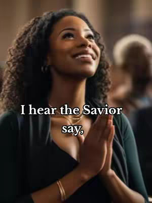 A medium shot features a woman with dark curly hair. She appears to be in a setting resembling a church. Her hands are clasped in front of her, and she has a serene expression, looking upwards. The lighting suggests an interior setting, possibly with stained glass.