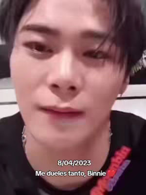 A selfie-style video shows a person with dark hair and their face filling most of the frame. The person appears to be looking down slightly, and the image has a warm, slightly desaturated tone. At the bottom of the image, text is overlaid in a white font.