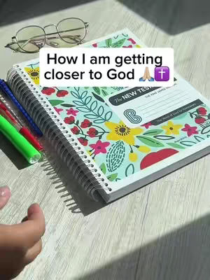 The cover image shows a bible opened on a table next to a pair of glasses and some colorful pens. Text overlayed on the bible states 'How I am getting closer to God'.