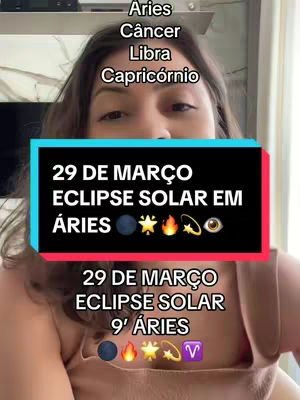 A woman is centered in the frame with the upper body visible, against a slightly blurred indoor background. Above her is a list of astrological signs: Aries, Câncer, Libra, Capricórnio. A rectangle is displayed in the center, containing text: '29 DE MARÇO ECLIPSE SOLAR EM ÁRIES' with astrological illustrations, along with additional text below: '29 DE MARÇO ECLIPSE SOLAR 9' ÁRIES' and additional astrological symbols.
