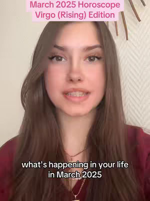 A young woman with long brown hair is centered in the frame. She is looking at the camera and speaking. Above her is a light pink banner with the text 'March 2025 Horoscope Virgo (Rising) Edition.' Below her is a black text overlay that says 'what's happening in your life in March 2025.' The background is a light beige wall.