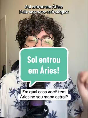 The cover image shows a man with curly hair and glasses partially obscuring his face. He's holding a microphone and wearing a patterned shirt. Overlaid on the image is a teal-colored rectangle containing text. The background suggests an indoor setting.