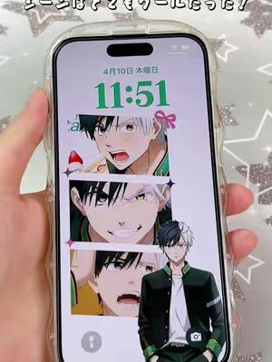 An iPhone displaying a lock screen with various manga character images and a hand holding the phone. The background is a lightly patterned surface. The display shows a layered image, with three panels of animated character faces stacked vertically, and a full figure of another character on the right side.
