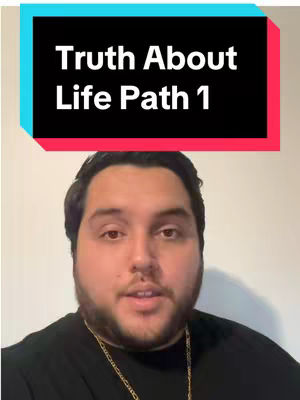 A man with a beard and a gold chain is centered with the words "Truth About Life Path 1" appearing in a colored rectangle at the top of a picture. The background is a plain white.