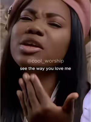 A close-up shot of a Black woman wearing a pink beret and making a face, with overlaid text. She has long black hair and is looking up, as if singing or speaking. The background is blurred, suggesting a performance or event setting.