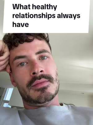 A man with a beard is positioned slightly off-center. Above him is a white rectangle with the text 'What healthy relationships always have'. The man is looking at the camera, his hand is supporting his head. The background is out of focus.